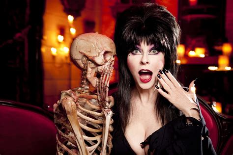 One lucky boil or ghoul will win a coveted Elvira Monster High doll! And 12 (un)lucky Runners Up will win prizes including a personally signed Elvira photo, an Elvira Funko Pop, NECA exclusives, and even a special “Boobie Prize!” Read contest rules here. Read contest rules here.